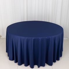 a round table with a blue cloth on it