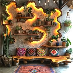 a room filled with lots of plants and potted plants on top of wooden shelves