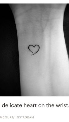 a heart tattoo on the wrist that reads, it is delicate heart on the wrist