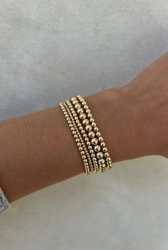 This curated stack consists of a mixture of 5 signature bracelets. (1) 2MM Yellow Gold Filled Beaded Bracelet (2) 3MM Yellow Gold Filled Beaded Bracelets (1) 4MM Yellow Gold Filled Beaded Bracelet  (1) 5MM Yellow Gold Filled Beaded Bracelet DETAILS: 14k Yellow Gold Non-tarnish & water safe Size: 5.75-8", XXS-XXXL 6 Gold Filled Bracelet Stack, Gold Beaded Bracelets Stack, Gold Bead Bracelet Stack, Braclets Gold, Gold Bracelet Stack, Gold Beaded Bracelets, Jewelry Stack, Gold Bracelets Stacked, Beaded Braclets