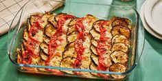 a casserole dish filled with eggplant, tomato sauce and other toppings