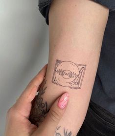 a woman's arm with a tattoo on it and the word mama written in cursive writing