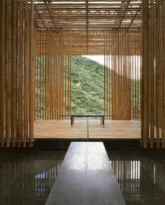 the inside of a building with bamboo curtains