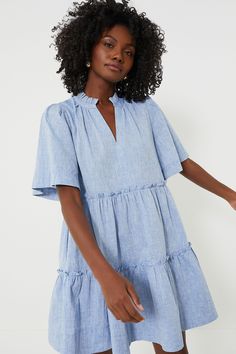 The Chambray Crawford Dress is exactly what we have been searching for — that perfect warm weather piece that you can throw on for morning cappuccinos and wear until cocktail hour. Featuring oversized flutter sleeves, ruffle detailing on the neckline and skirt, and a swing silhouette in a timeless blue hue, this mini is the most flattering and flirty frock. Effortlessly whisking you from work to play, pair with sneakers and sunnies for a casual look then switch to wedges and statement earrings f Tuckernuck Dress, Kenzo Dress, Chambray Fabric, Chambray Dress, Night Outfits, Flutter Sleeve, Chambray, Date Night Outfit, Linen Blend