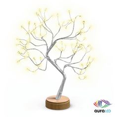 a lighted tree on a wooden stand with white lights in the shape of a twig