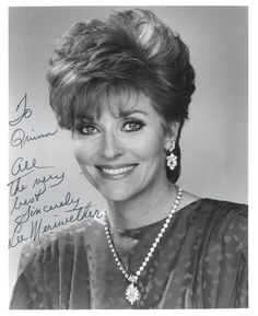 an old photo of a woman smiling for the camera with her name written on it