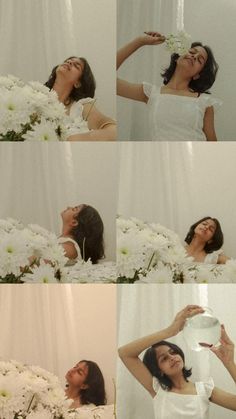 a woman is drinking water from a bottle while surrounded by white flowers and daisies