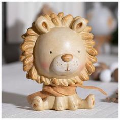 a ceramic lion figurine sitting on top of a table