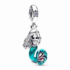 Journey beyond the sea with our Disney The Little Mermaid Ariel Dangle Charm, inspired by the new live-action film adaptation. Celebrate your free spirit and curious heart by adding this sterling silver charm to your collection. Ariel's face and locs are brought to life with engraved details, and her mermaid tail shines with hand-applied teal and cerise enamel. A sparkling aurora borealis clear cubic zirconia rests atop the bail, like the sun reflecting on the ocean waves. Keep Ariel by your sid Pandora Original, Ariel Disney, Charms Pandora, Pandora Disney, Bracelet Pandora, Wedding Pendant, Turtle Charm, Bracelet Diy, Ariel The Little Mermaid