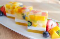 fruit slices are arranged on a white plate