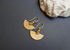 Small gold earrings. Hand-hammered brass earrings. Rustic earrings. Artisan earrings. Everyday earrings. Minimalist earrings. Dainty gold earrings. Half-circle earrings. Unique jewelry. Raw bass earrings. ● Materials: Brass ● Measures: - Length - about 1.3 inches (3.3 cm) x 0.87 inches (2.2 cm) wide All my jewelry is my own original design and handcrafted by me. The color and brightness of the product in the photograph depending on the settings of your monitor. Thank You so much for looking at m Small Gold Earrings, Dainty Gold Earrings, Rustic Earrings, Hammered Brass, Artisan Earrings, Earrings Women, Everyday Earrings, Earrings Boho, Copper Earrings