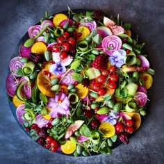 a platter filled with lots of different types of vegetables