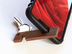 a wooden key holder with keys in it