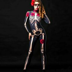 a woman in skeleton bodysuit with roses on her head and hands behind her back