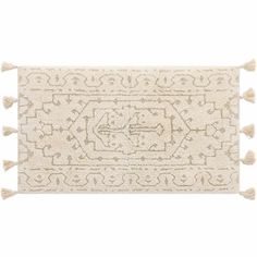 a white rug with tassels on it