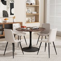 a dining table with four chairs around it