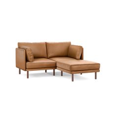 a tan leather sectional sofa and ottoman