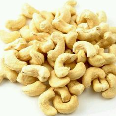 raw cashews on white background with clipping path to the top right side