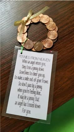 a card that has some coins on top of it with a note attached to it