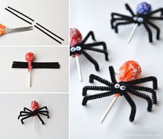 some lollipops are wrapped in black paper and spider is sitting on top of them