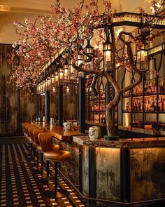 the bar is decorated with cherry blossom trees