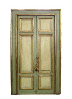 an old wooden door with gold trim