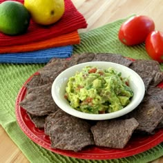 a plate with chips and guacamole on it