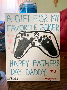 a father's day card with a video game controller