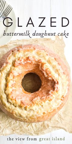 A glazed old fashioned doughnut bundt cake on parchment paper Old Fashioned Doughnut Cake, Bundt Pan Cake Recipes, Glazed Buttermilk Donut Cake, Buttermilk Doughnut Cake, Bundt Pan Recipes Breakfast, Old Fashioned Bundt Cake, Bundt Pan Coffee Cake, Bundt Pan Coffee Cake Recipes, Vintage Bundt Cake Recipes