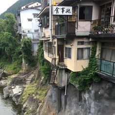 an apartment building on the side of a river