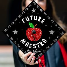 a woman in a graduation cap that says future maestra with an apple on it