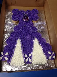 a purple teddy bear cake in a box