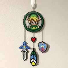 an image of a pixelated clock hanging on the wall with other items attached to it