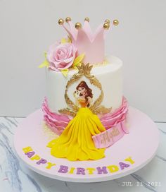 a princess themed birthday cake on a plate