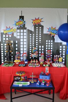 a table topped with lots of candy and decorations