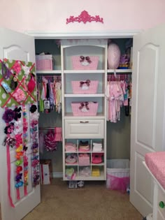 the closet is filled with pink and white items