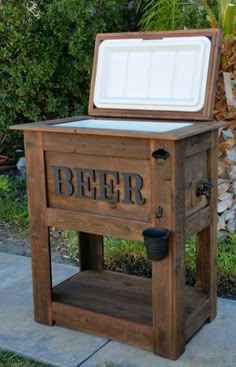 an old fashioned cooler is sitting on the sidewalk