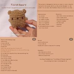 a crocheted teddy bear sitting on top of a table next to a white sheet