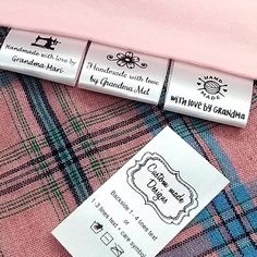 three labels on the back of a pink shirt