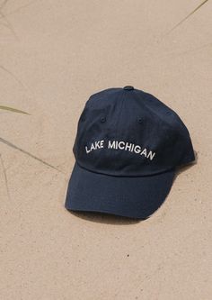 This Lake Michigan "Dad Hat" is a classic. The vintage denim color is sure to match every outfit all year round. Embroidered locally in Grand Rapids. Regular fit 100% Cotton Hand wash Classic Summer Hats With Embroidered Logo, Classic Summer Hat With Embroidered Logo, Summer Baseball Cap With Embroidered Logo And Short Brim, Vintage Blue Cotton Baseball Cap, Vintage Cotton Baseball Cap For Summer, Vintage Cotton Dad Hat With Flat Bill, Vintage Cotton Dad Hat One Size, Vintage Cotton Dad Hat One Size Fits Most, Casual Cotton Hat With Curved Brim