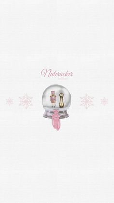 a snow globe with a pink bow on it and the words nutcracker inside