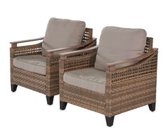 two wicker chairs sitting next to each other