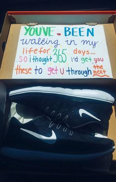 a pair of nike shoes in a box with a sign on the inside that says you've been waiting in my life for 350 days so i thought to get through