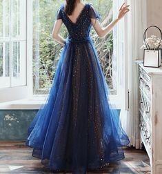 Material: Tulle Color:Navy Blue Hemline:Floor Length  Back Details:Lace-up Dress Number: #G2WS Delivery times: Processing time:    2-3 weeksShipping time:       3-5 working days Rush Order is available, for rush order, the processsing time is only 7-12 working days. Custom Measurements For custom size, please leave us Blue A-line Evening Dress For Banquet, Blue A-line Dress For Prom, Royal Blue A-line Evening Dress For Prom, Blue A-line Ball Gown For Formal Occasions, Blue A-line Tulle Evening Dress, Fitted Blue Ball Gown Dress, Blue A-line Tulle Dress, Fitted Blue Tulle Ball Gown, Blue Fitted Tulle Dress