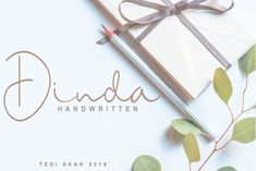 an image of a pen and paper with the words dida handwritten on it