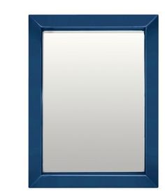 a blue framed mirror on a white wall with a black border around the edges and bottom edge