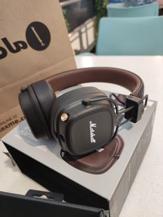 a pair of headphones sitting on top of a box