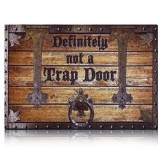 a wooden sign that says definitely not a trap door