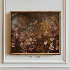 a painting hanging on the wall in a room