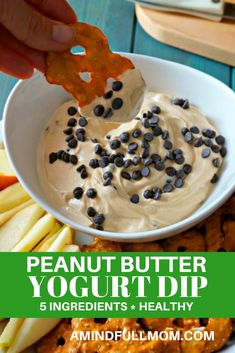 peanut butter yogurt dip in a white bowl with chocolate chips on the side